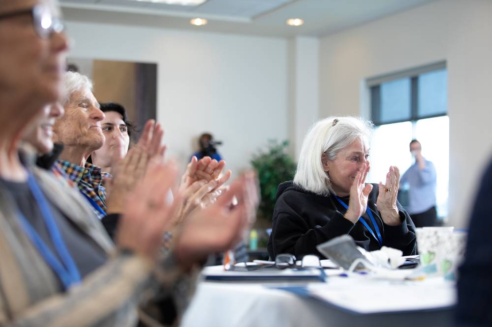 Participants clapping at the 13th Annual Local History Roundtable.